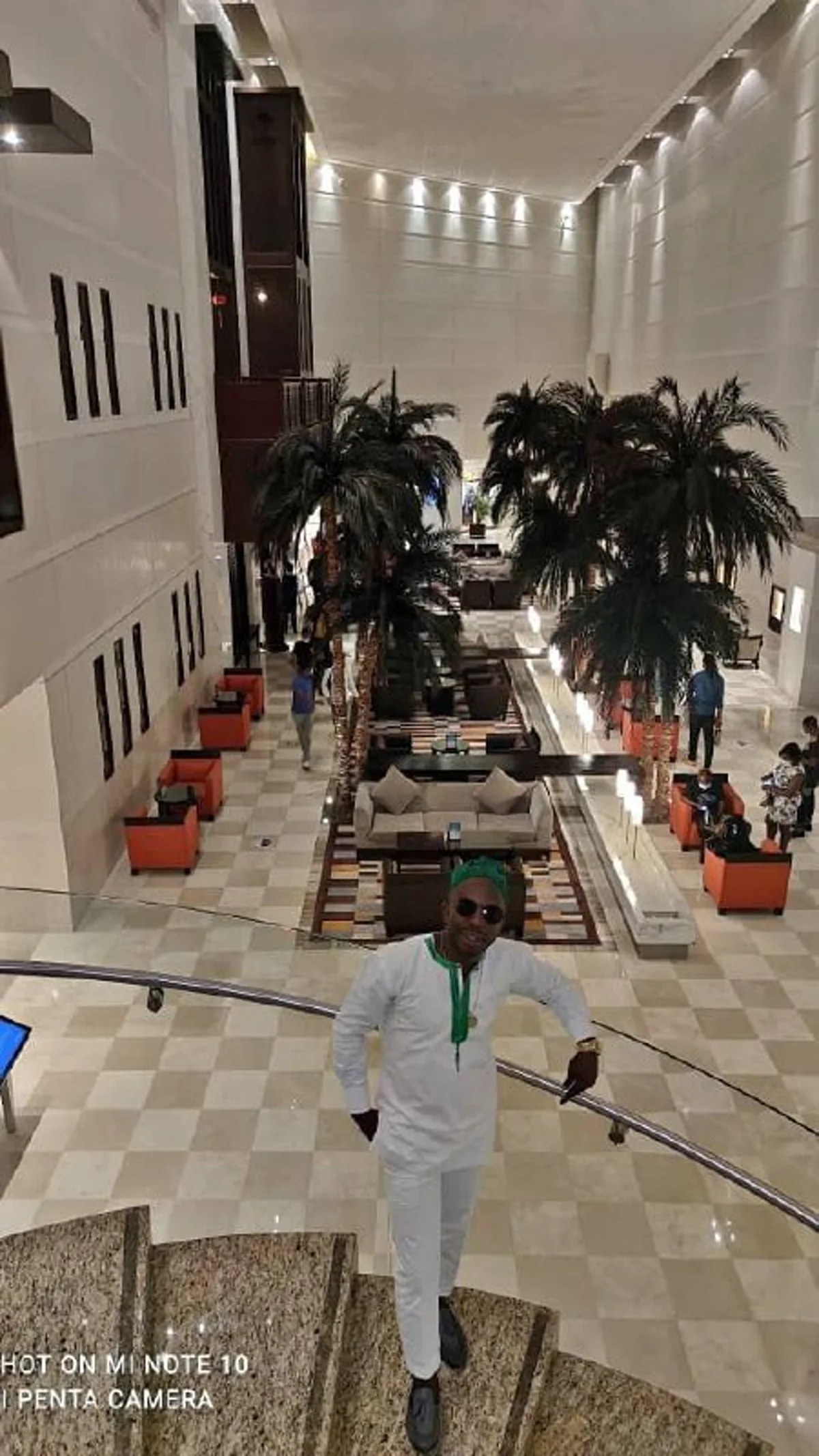 Ngala Killian photographed inside a lobby